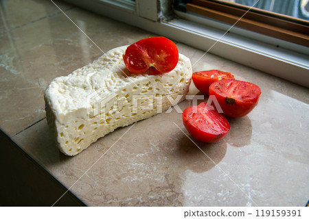 Quick snack in Georgia young cheese (Imerensky) - piece of cheese and 2 oieces of tomato Quick snack in Georgia young cheese (Imerensky) - piece of cheese and 2 oieces of tomato 119159391
