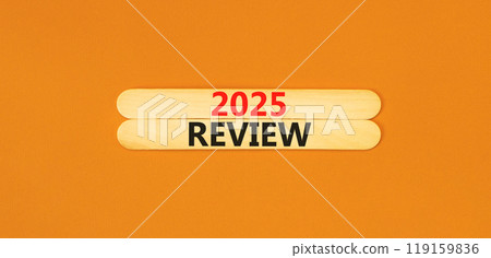 Planning 2025 review new year symbol. Concept words 2025 Review on beautiful wooden sticks. Beautiful orange background. Business 2025 review new year concept. Copy space. 119159836