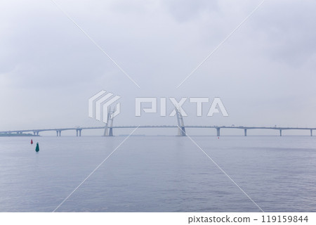 distant bridge over foggy bay on rainy day distant bridge over foggy bay on rainy day 119159844