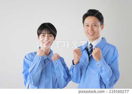 Male and female staff wearing work clothes _ fist pump with both hands _ 3 Male and female staff wearing work clothes _ fist pump with both hands _ 3 119160277