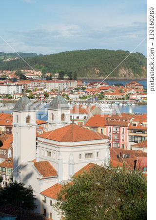Aerial view of Ribadesella with its church. Sunny day. Asturias, Spain Aerial view of Ribadesella with its church. Sunny day. Asturias, Spain 119160289