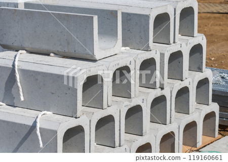 U-shaped gutters stored at a construction site U-shaped gutters stored at a construction site 119160661