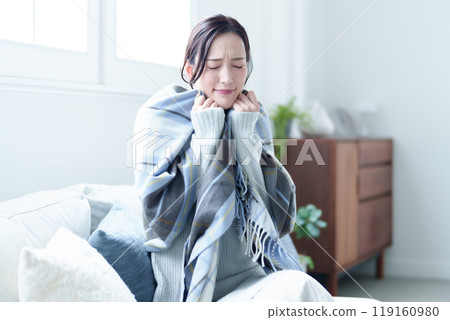 Cold and shivering woman 119160980