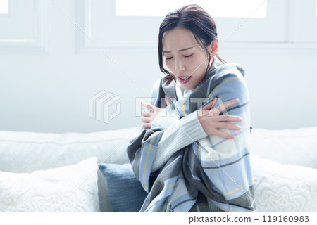 Cold and shivering woman Cold and shivering woman 119160983
