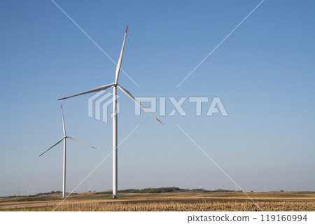 Wind turbines on an agricultural field. Sustainable energy 119160994