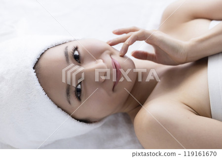 Woman taking care of her face 119161670