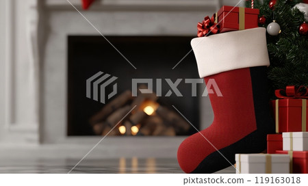 A red stocking sits in front of a fireplace with a tree and presents. A red stocking sits in front of a fireplace with a tree and presents. 119163018