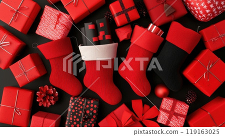 A pile of red presents and red stockings with a black background 119163025