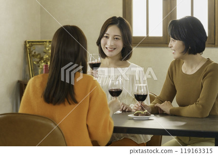 Girls' night out: Three women drinking wine Girls' night out: Three women drinking wine 119163315