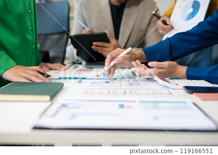 Marketing staff are analyzing the data to business planning at office. Marketing staff are analyzing the data to business planning at office. 119166551