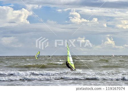 Windsurfing surfer in rough seas 119167074