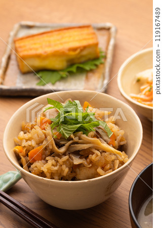 Cooked rice on a wooden table Cooked rice on a wooden table 119167489