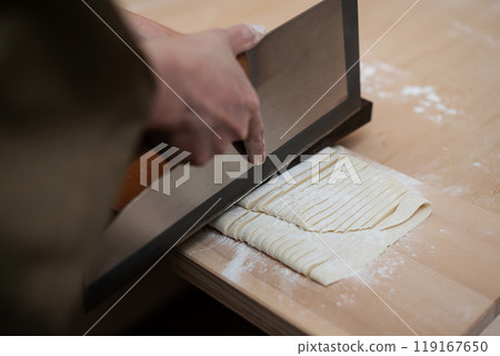 Handmade udon noodles, noodle cutting Handmade udon noodles, noodle cutting 119167650
