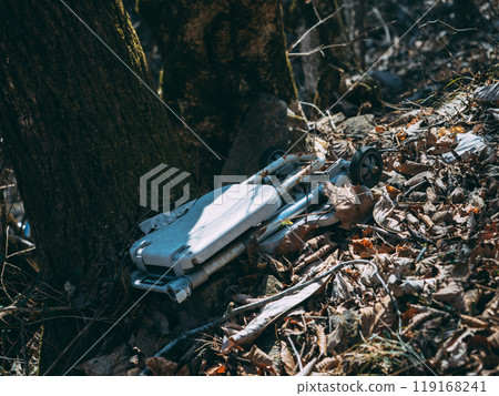 A wheelbarrow abandoned deep in the mountains 119168241