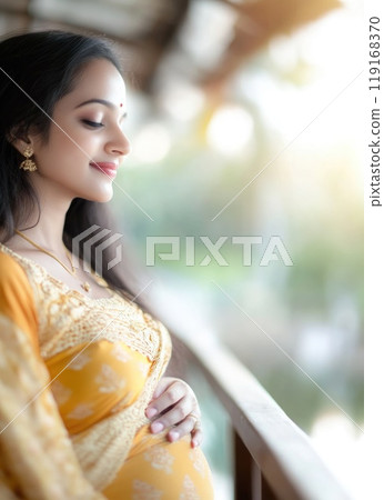 Maternal Serenity: pregnant Indian woman, grace of impending motherhood, portrayed in traditional clothing with cultural motifs, reflecting joy, significance of this special time in her life. 119168370