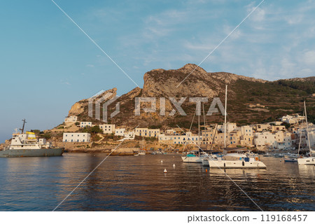Ships moored in harbor and calm sea Ships moored in harbor and calm sea 119168457