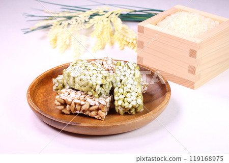 White rice and rice crackers in a wooden box 119168975