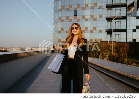 Woman with Shopping Bags Outdoor in City Woman with Shopping Bags Outdoor in City 119169256