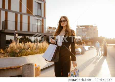 Stylish Woman Shopping Outdoors 119169258