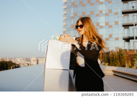 Woman Shopping Outdoors Woman Shopping Outdoors 119169265