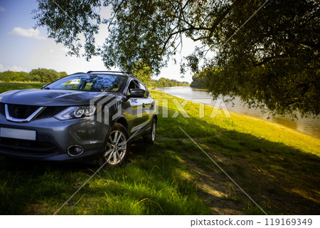 Gray SUV by the River in Nature Gray SUV by the River in Nature 119169349