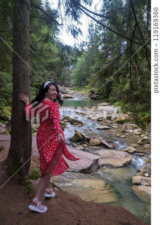 Woman in Red Dress by Serene Forest River 119169360