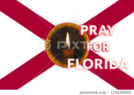An American flag flutters amidst stormy skies as a hurricane approaches Milton, Florida. A symbol of resilience, with the community coming together in prayer, reflecting hope and unity An American flag flutters amidst stormy skies as a hurricane approaches Milton, Florida. A symbol of resilience, with the community coming together in prayer, reflecting hope and unity 119169909