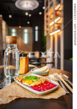 Breakfast with fried eggs and salmon close up. Breakfast with fried eggs and salmon close up. 119169964