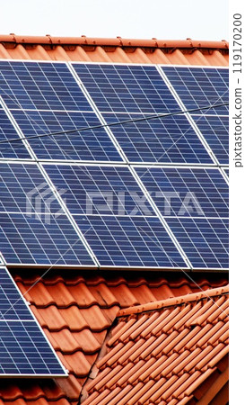 Historic farm house with modern solar panels on roof and wall 119170200