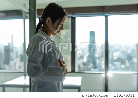 A woman in a white coat A woman in a white coat 119170331
