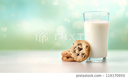A glass of milk with two chocolate chip cookies on a table, copy space 119170950