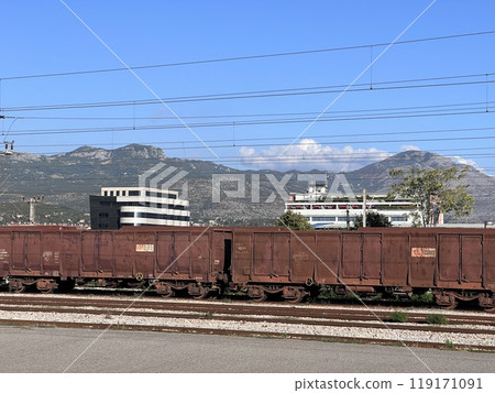 rail freight cars on rails in Podgorica, mountains rail freight cars on rails in Podgorica, mountains 119171091