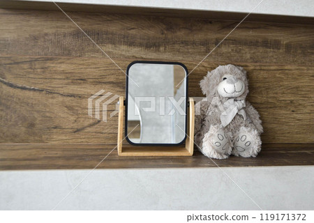 two cute hugging teddy bears, on an old wooden floor 119171372