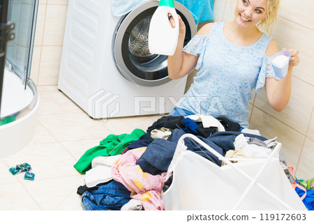 Woman doing clothes laundry 119172603