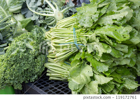 Fresh organic turnip greens sitting on table at farmers market in spain 119172761