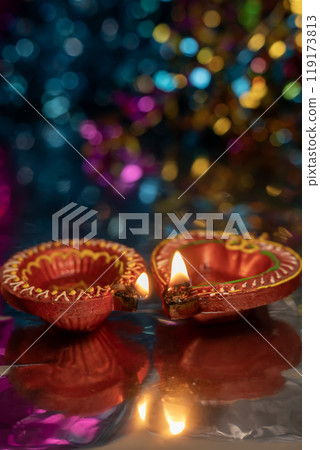 Decorative clay diyas with bokeh background for Indian Diwali festival celebration. 119173813