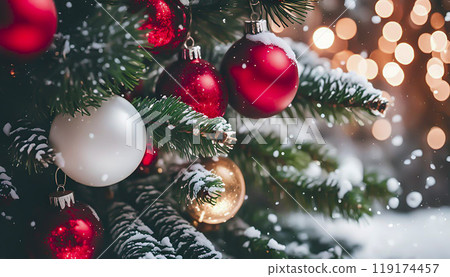 Christmas decorations, assorted balls pine branches with snow and warm bokeh lights 119174457