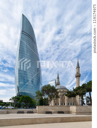 Sehitler Mosque, or Mosque of the Martyrs in front of the Flame Towers in Baku, Azerbaijan 119174975