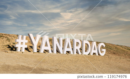 Sign with hashtag YANARDAG atop Yanar Dag, a natural gas fire burning continuously on a hillside in Baku, Azerbaijan Sign with hashtag YANARDAG atop Yanar Dag, a natural gas fire burning continuously on a hillside in Baku, Azerbaijan 119174976