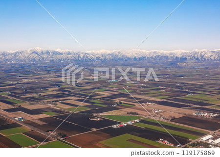 Fields spreading across the Hidaka Mountains and the Tokachi Plain, before landing at Tokachi Obihiro Airport, Hokkaido Fields spreading across the Hidaka Mountains and the Tokachi Plain, before landing at Tokachi Obihiro Airport, Hokkaido 119175869