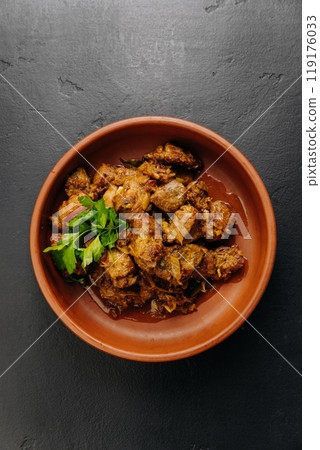 Traditional homemade roasted meat with onions and greens, food photography and culinary blogs Traditional homemade roasted meat with onions and greens, food photography and culinary blogs 119176033