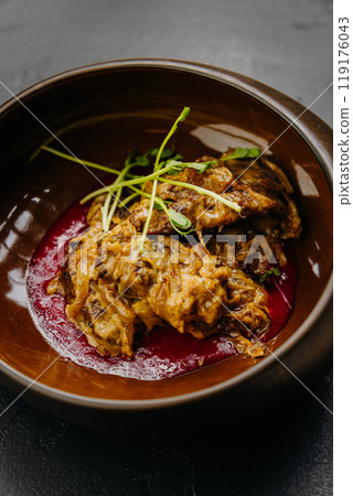Slow-cooked meat stew served in bowl with sauce and fresh herbs. Ideal for stock food photography Slow-cooked meat stew served in bowl with sauce and fresh herbs. Ideal for stock food photography 119176043