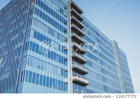 Beautiful business center in Moscow. blue apartment building. Urban modern architecture. Urban landscape. glass high-rise building 119177772