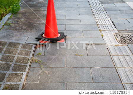 Cobblestone road with poor foundations 119178234