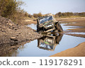 Off road buggy crossing water obstacle 119178291