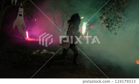 Zombie Woman Dances In An Enchanted Halloween Forest At Night 119179313