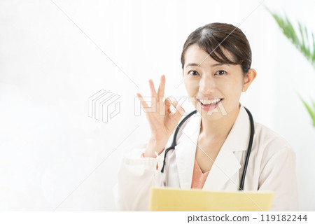 Female doctor making an OK sign 119182244