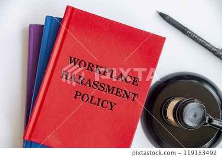 Top view of Workplace Harassment Policy book with gavel on white background. Zero workplace harassment concept Top view of Workplace Harassment Policy book with gavel on white background. Zero workplace harassment concept 119183492