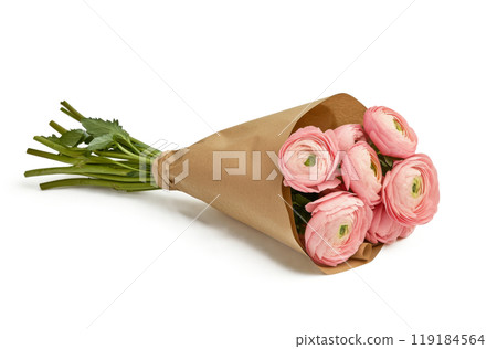 Beautiful bouquet of pink ranunculus flowers wrapped in kraft paper on a white background 119184564