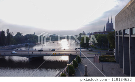 Drone point of view of Wroclaw with Peace bridge (cars and people) and  Cathedral of St.John the Baptist (two towers) and Oder 119184623